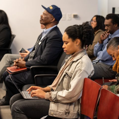 Documenters D'Asha Davis (center) and Danielle Bryant (behind Davis) attend an Invest Atlanta Board of Directors meeting on Thursday, Feb. 16, 2023. Photo by Dean Hesse.