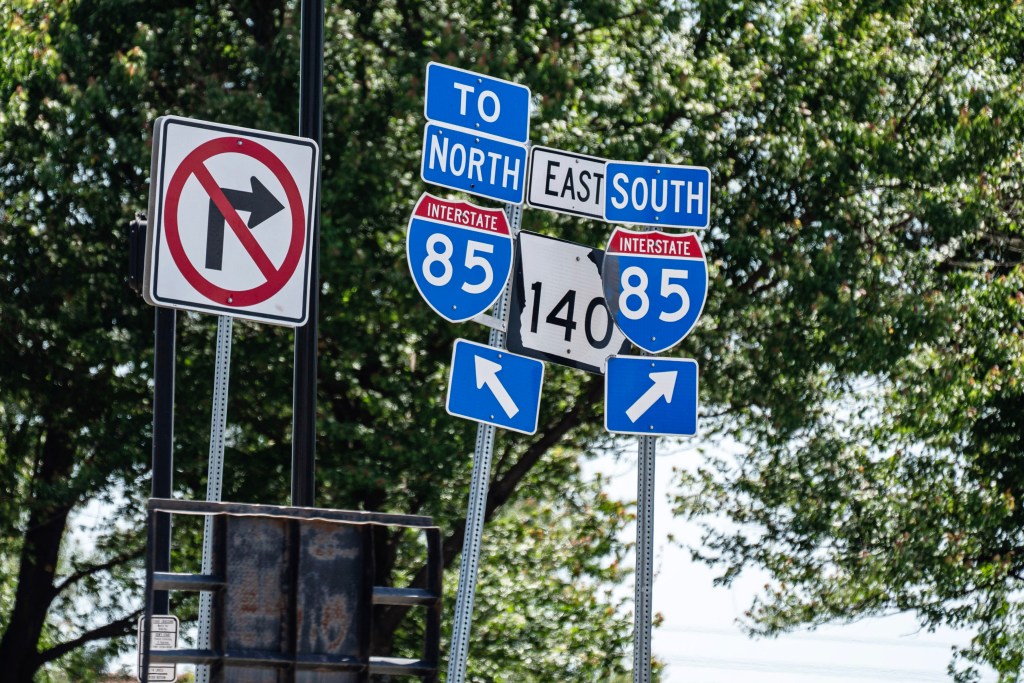 Traffic signage at Jimmy Carter Boulevard and I-85 in Norcross, Georgia.