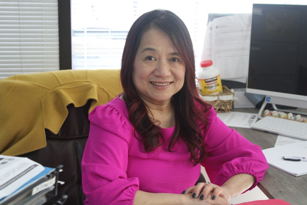 Trinh Pham, executive director of the Atlanta chapter of Boat People SOS (BPSOS), sits behind her desk at her office in Norcross, Georgia.
