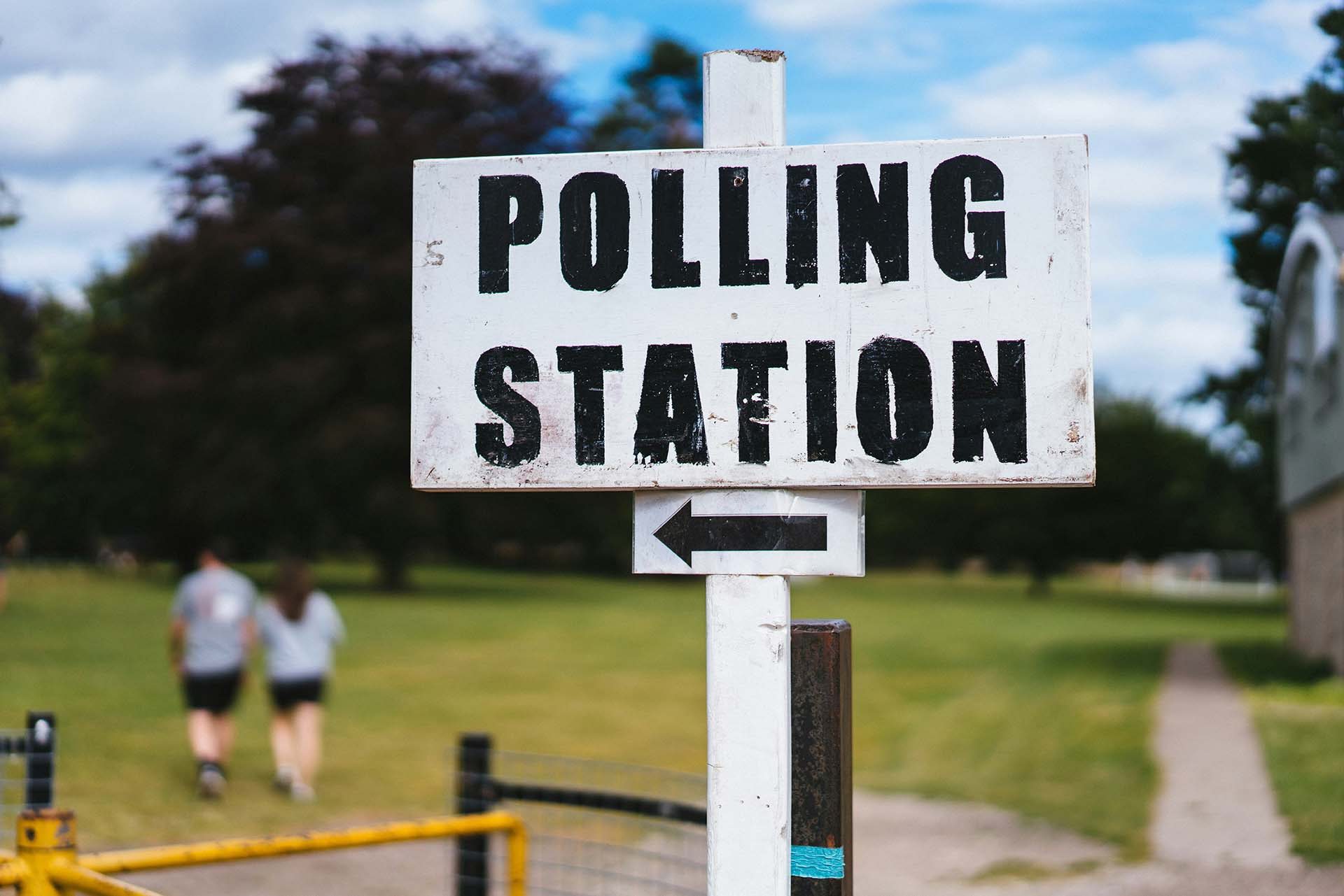 A directional sign to a polling station.