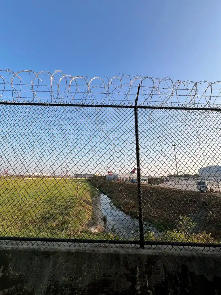 View of the Flint River flowing beside the Delta Flight Museum in Hapeville, Georgia.