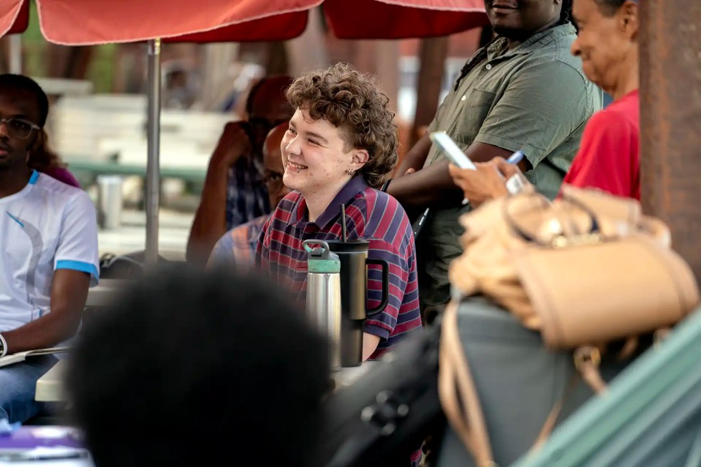 Tri-Cities residents attend a meeting on the patio of Atlanta Utility Works in East Point, Georgia.