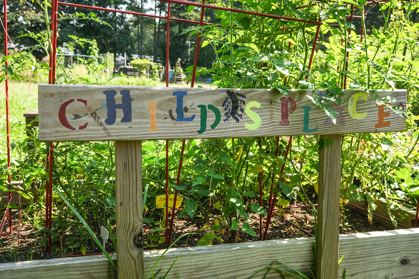 A wooden sign painted with the words, "Child's Place".
