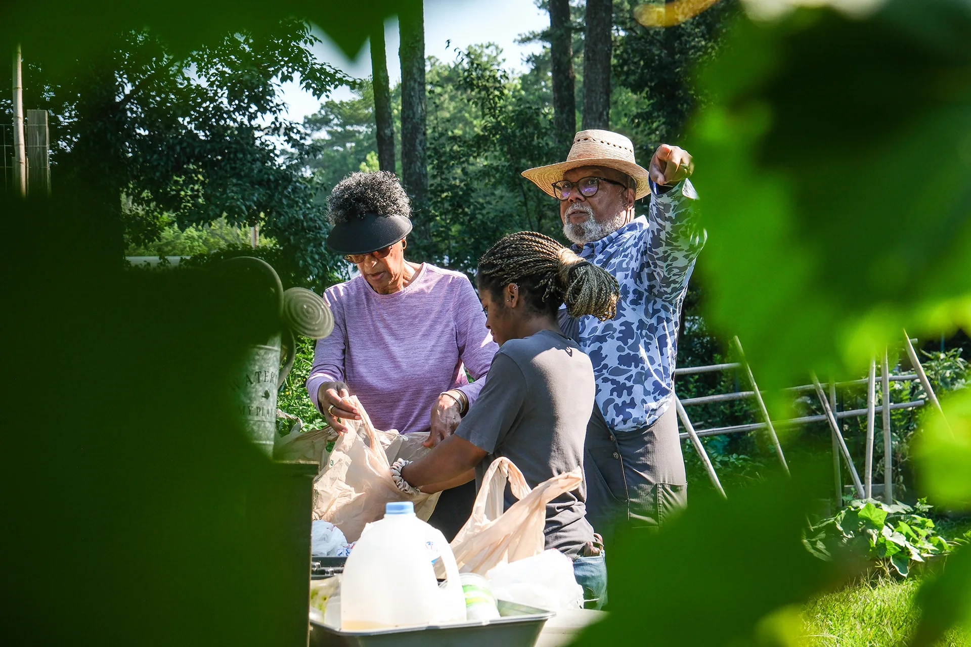 Columbus Brown and two others work in the Stone Mountain Community Garden.